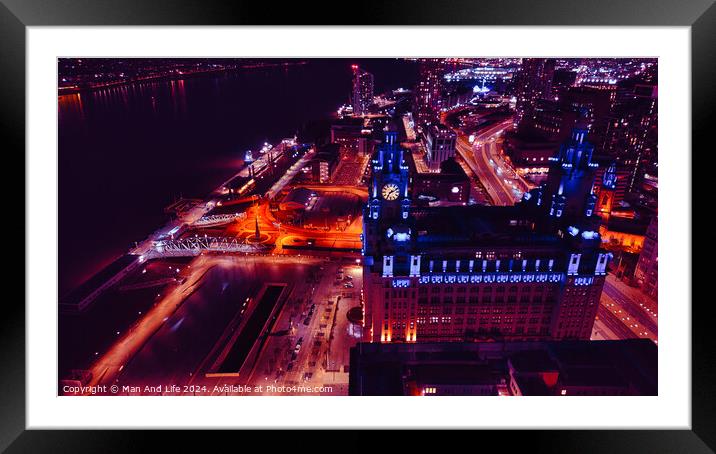 Aerial night view of a cityscape with illuminated streets and buildings in Liverpool, UK. Framed Mounted Print by Man And Life