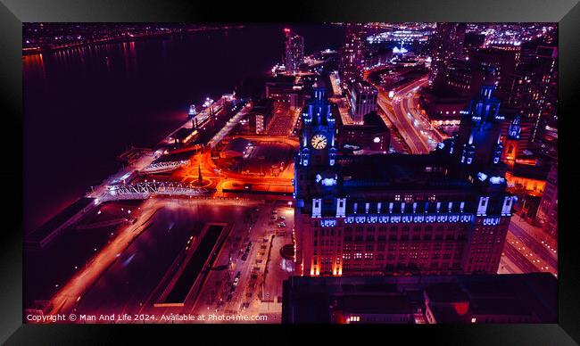 Aerial night view of a cityscape with illuminated streets and buildings in Liverpool, UK. Framed Print by Man And Life