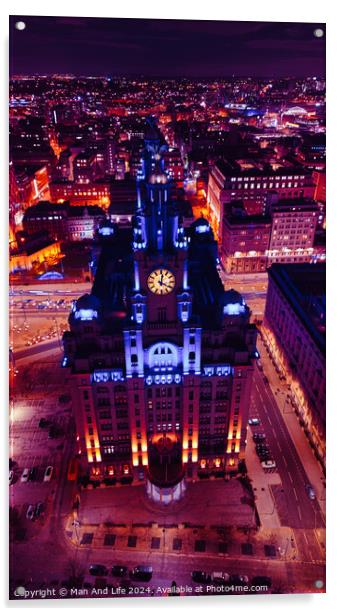 Vertical aerial view of a lit-up cityscape at night with a prominent clock tower and urban streets in Liverpool, UK. Acrylic by Man And Life