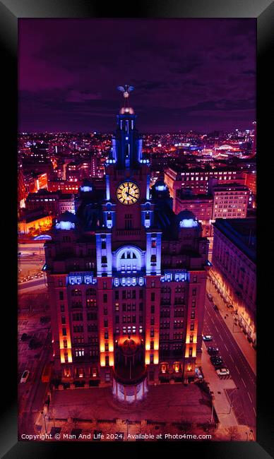 Vertical aerial view of an illuminated historic building at night with city lights in the background in Liverpool, UK. Framed Print by Man And Life
