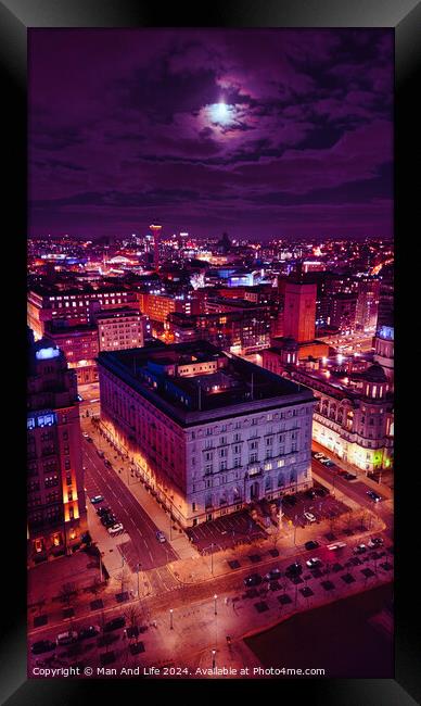 Vertical aerial view of an illuminated historic building at night with city lights in the background in Liverpool, UK. Framed Print by Man And Life