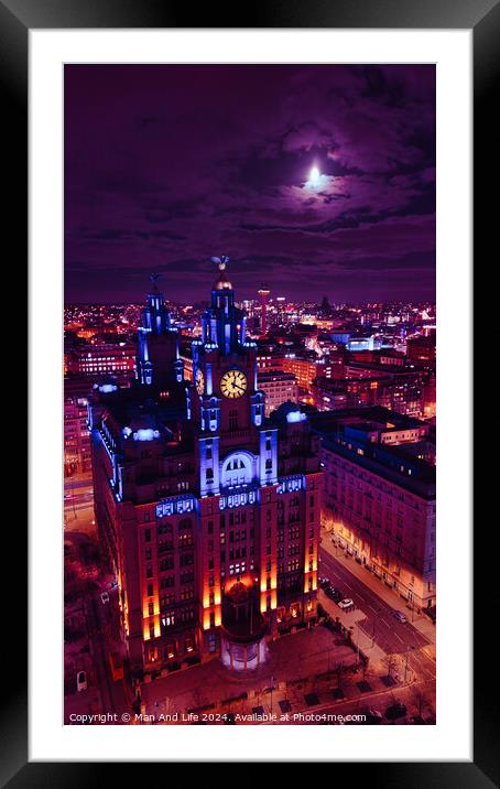 Moonlit cityscape with illuminated historic building at night, showcasing urban architecture against a dramatic sky in Liverpool, UK. Framed Mounted Print by Man And Life