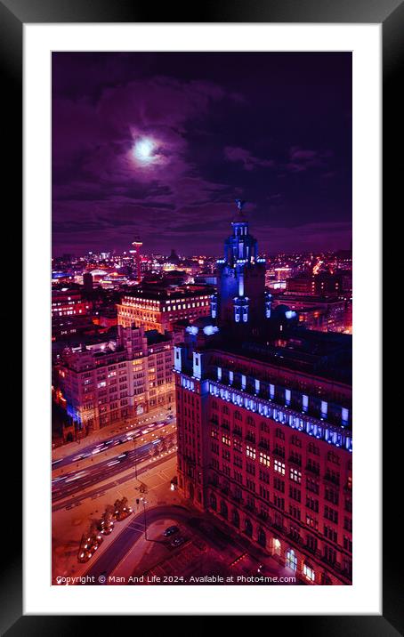 Cityscape at night with illuminated buildings under a moonlit sky in Liverpool, UK. Framed Mounted Print by Man And Life