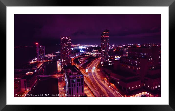 Night cityscape with illuminated buildings and streets, showcasing urban architecture and traffic trails under a purple sky in Liverpool, UK. Framed Mounted Print by Man And Life