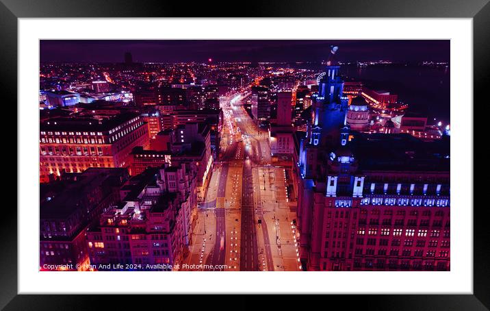Aerial night view of a cityscape with illuminated streets and buildings, showcasing urban architecture and traffic in Liverpool, UK. Framed Mounted Print by Man And Life