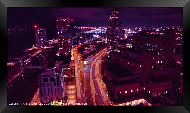 Aerial night view of a vibrant cityscape with illuminated streets and buildings in Liverpool, UK. Framed Print by Man And Life