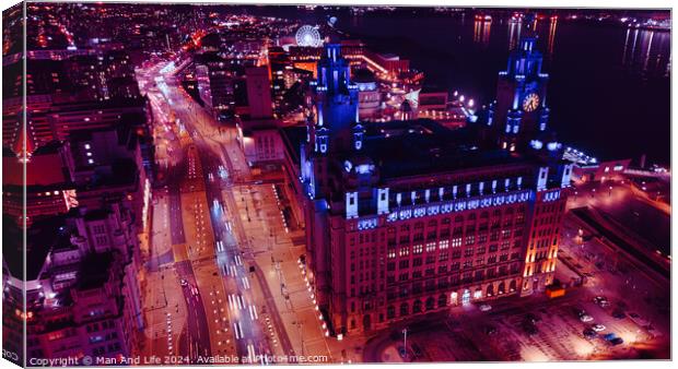 Aerial night view of an illuminated cityscape with a prominent clock tower and urban streets in Liverpool, UK. Canvas Print by Man And Life