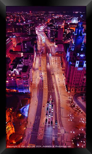 Aerial night view of a bustling city street with vibrant lights and traffic in Liverpool, UK. Framed Print by Man And Life