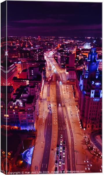 Vertical aerial view of a bustling city street at night with vibrant purple lighting and traffic trails in Liverpool, UK. Canvas Print by Man And Life