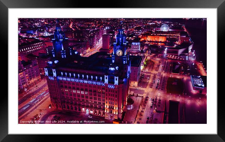 Aerial night view of an illuminated urban cityscape with historic architecture in Liverpool, UK. Framed Mounted Print by Man And Life