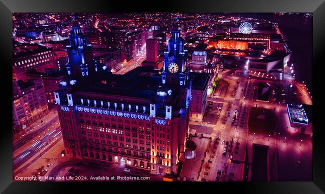 Aerial night view of an illuminated urban cityscape with historic architecture in Liverpool, UK. Framed Print by Man And Life