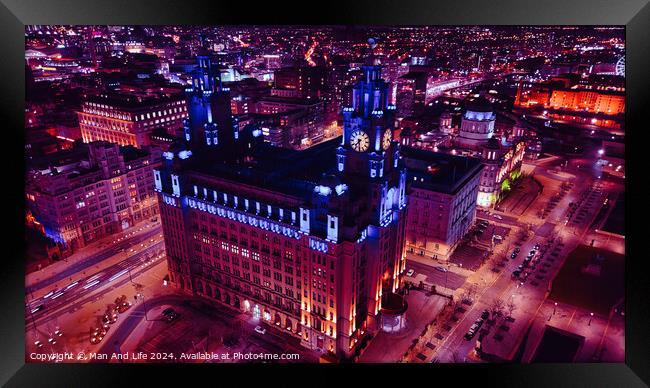 Aerial night view of an illuminated urban cityscape with historic architecture in Liverpool, UK. Framed Print by Man And Life