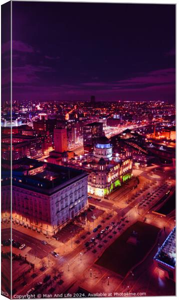 Vertical aerial view of a city at night with illuminated streets and buildings, showcasing urban nightlife in Liverpool, UK. Canvas Print by Man And Life