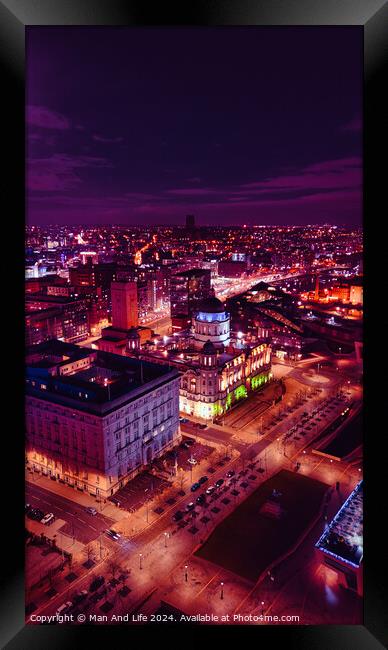 Vertical aerial view of a city at night with illuminated streets and buildings, showcasing urban nightlife in Liverpool, UK. Framed Print by Man And Life