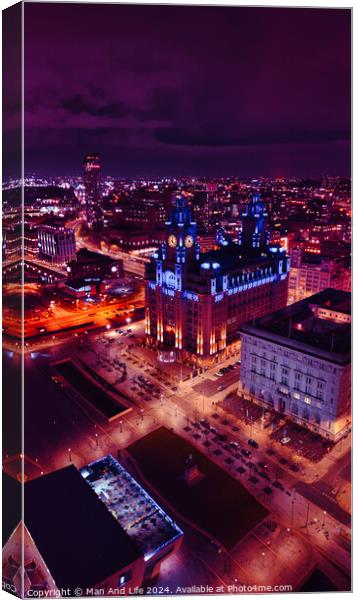 Aerial night view of a cityscape with illuminated buildings and streets, showcasing urban architecture and vibrant city life in Liverpool, UK. Canvas Print by Man And Life