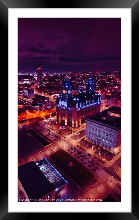 Aerial night view of a cityscape with illuminated buildings and streets, showcasing urban architecture and vibrant city life in Liverpool, UK. Framed Mounted Print by Man And Life