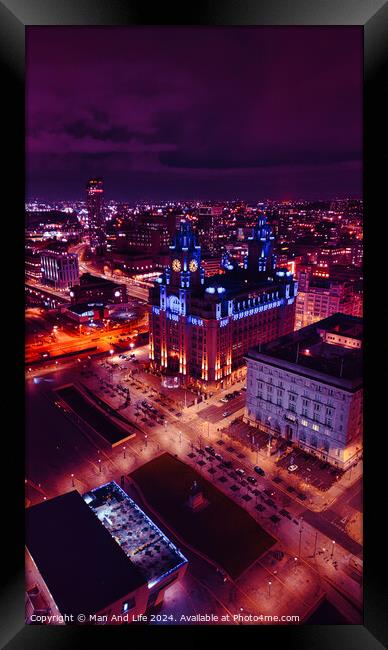 Aerial night view of a cityscape with illuminated buildings and streets, showcasing urban architecture and vibrant city life in Liverpool, UK. Framed Print by Man And Life
