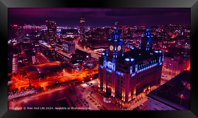 Night cityscape with illuminated buildings and streets, showcasing urban architecture and vibrant nightlife in Liverpool, UK. Framed Print by Man And Life