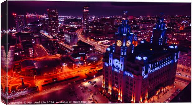 Aerial night view of a vibrant cityscape with illuminated streets and an iconic building in Liverpool, UK. Canvas Print by Man And Life