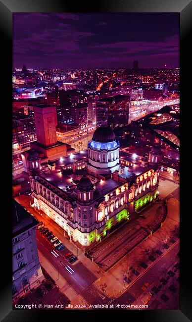 Aerial night view of an illuminated historic building in an urban setting, showcasing vibrant city lights and architecture in Liverpool, UK. Framed Print by Man And Life