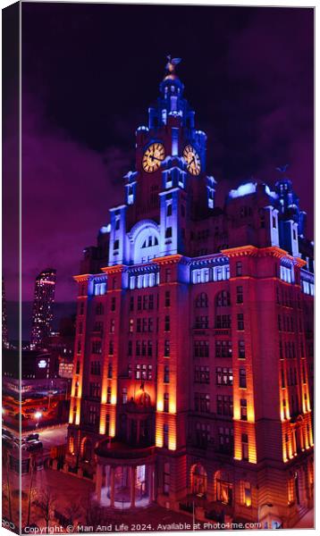 Dramatic night view of an illuminated historic building with clock tower against a twilight sky in Liverpool, UK. Canvas Print by Man And Life