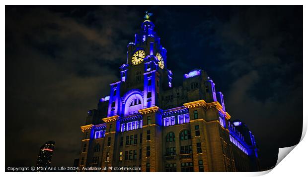 Liverpool's iconic Royal Liver Building at night, illuminated with blue and yellow lights against a dark sky. Print by Man And Life