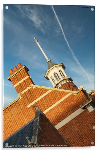 Historic brick building with a distinctive cupola against a blue sky with contrails. Acrylic by Man And Life