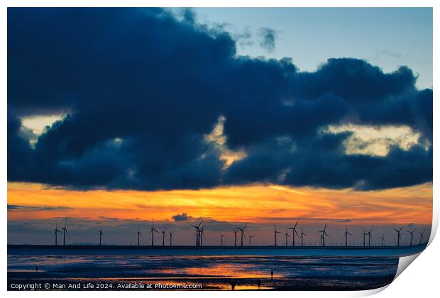 Sunset over sea with silhouette of offshore wind turbines, vibrant sky, and reflection on water in Crosby, England. Print by Man And Life