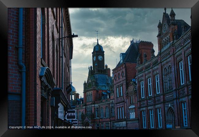 Historic European cityscape with clock tower at dusk, moody sky, and vintage architecture in York, UK. Framed Print by Man And Life