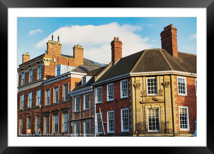 Historic brick buildings with classic British architecture under a clear blue sky in York, UK. Framed Mounted Print by Man And Life