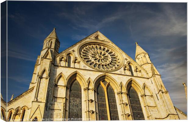Gothic cathedral facade with rose window under blue sky in York, UK. Canvas Print by Man And Life