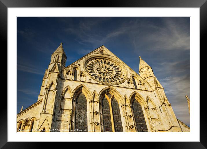 Gothic cathedral facade with rose window under blue sky in York, UK. Framed Mounted Print by Man And Life