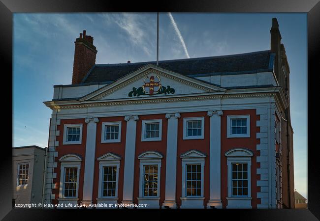 Classic red and white building facade with clear blue sky at dusk in York, UK. Framed Print by Man And Life