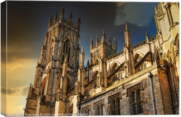 Majestic Gothic cathedral against a dramatic sky at sunset, showcasing intricate architecture and historical grandeur in York, UK. Canvas Print by Man And Life