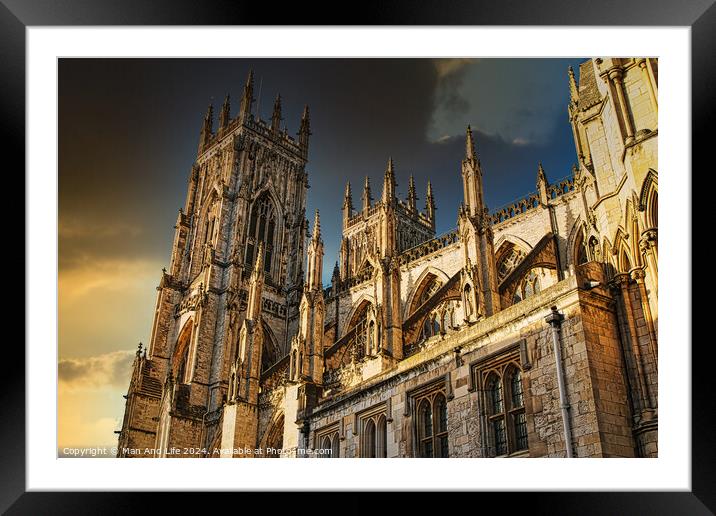 Majestic Gothic cathedral against a dramatic sky at sunset, showcasing intricate architecture and historical grandeur in York, UK. Framed Mounted Print by Man And Life