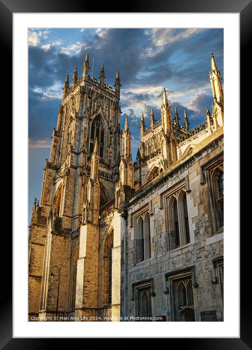 Gothic cathedral against a dramatic sky at sunset, showcasing intricate architecture and historical grandeur in York, UK. Framed Mounted Print by Man And Life