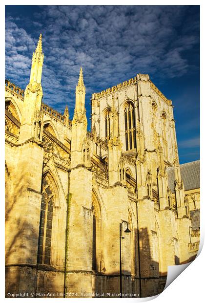 Gothic cathedral facade with spires against a clear blue sky at sunset, showcasing historical architecture in York, UK. Print by Man And Life