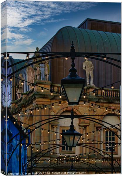 Dusk view of a classical building with a street lamp in the foreground and decorative lights, evoking a romantic urban scene in Harrogate, England. Canvas Print by Man And Life