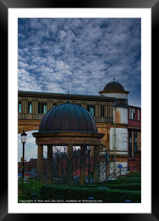 Dramatic sky over an architectural dome and building with a bridge in the background in Harrogate, England. Framed Mounted Print by Man And Life