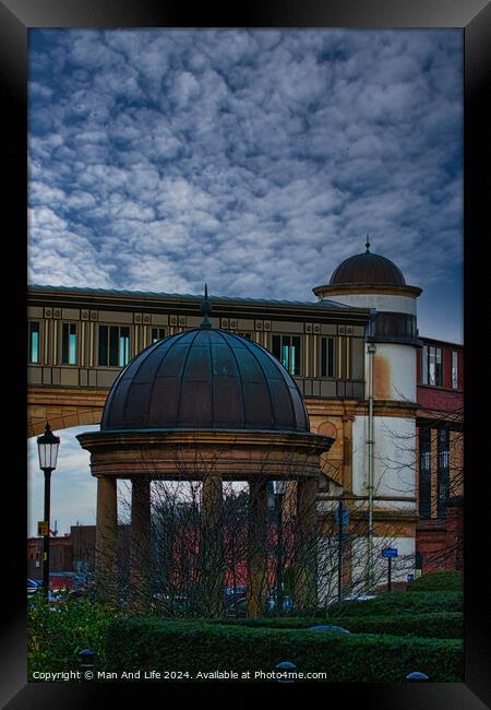 Dramatic sky over an architectural dome and building with a bridge in the background in Harrogate, England. Framed Print by Man And Life
