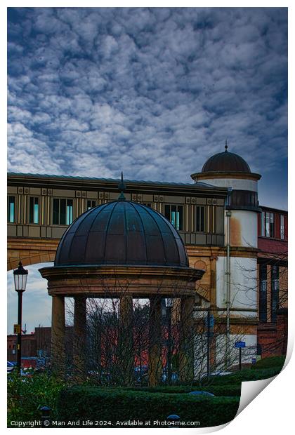 Dramatic sky over an architectural dome and building with a bridge in the background in Harrogate, England. Print by Man And Life