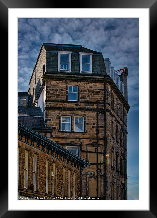 Vintage building corner against a dramatic cloudy sky in Harrogate, England. Framed Mounted Print by Man And Life