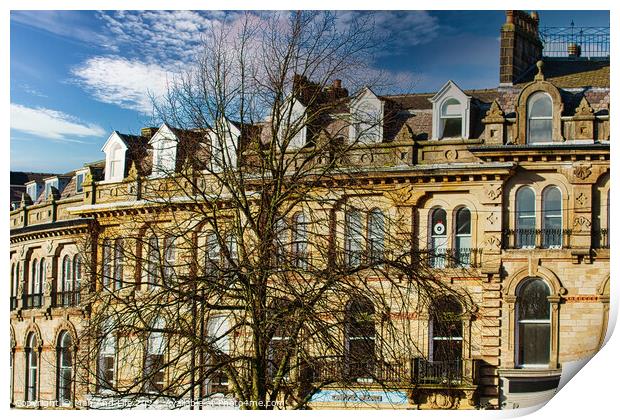 Vintage building corner against a dramatic cloudy sky in Harrogate, England. Print by Man And Life