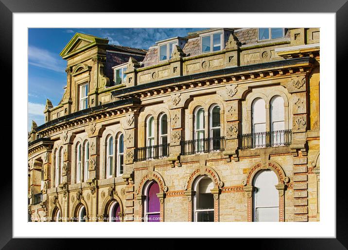 Vintage building corner against a dramatic cloudy sky in Harrogate, England. Framed Mounted Print by Man And Life