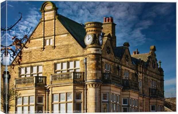 Historic stone building with clock tower under blue sky in Harrogate, England. Canvas Print by Man And Life