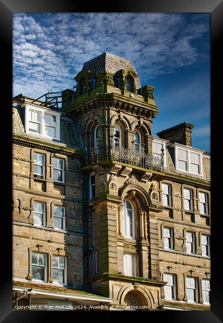 Victorian architecture with ornate details on a historic building against a blue sky with clouds in Harrogate, England. Framed Print by Man And Life