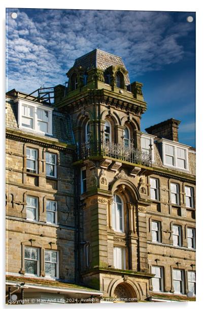 Victorian architecture with ornate details on a historic building against a blue sky with clouds in Harrogate, England. Acrylic by Man And Life