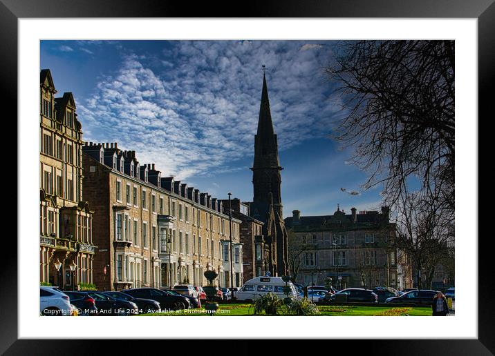 Classic European street with historic architecture and a church spire under a dramatic cloudy sky in Harrogate, England. Framed Mounted Print by Man And Life