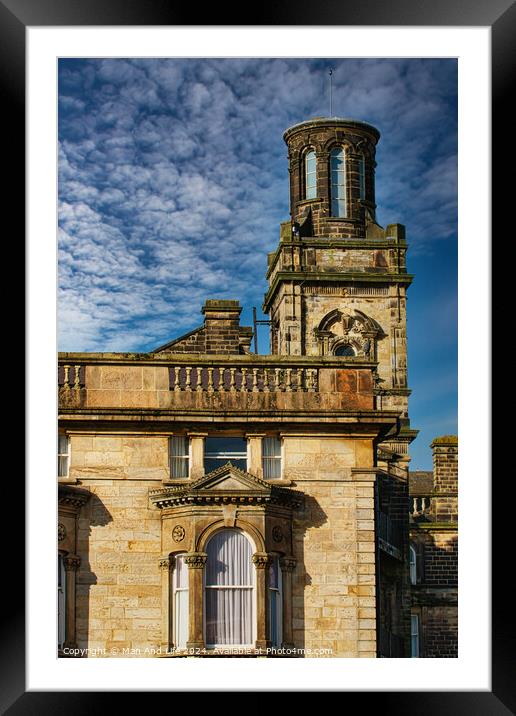 Historic stone building with a tower under a blue sky with textured clouds in Harrogate, England. Framed Mounted Print by Man And Life