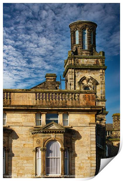 Historic stone building with a tower under a blue sky with textured clouds in Harrogate, England. Print by Man And Life